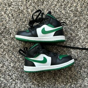 Green and Black jordan 1’s